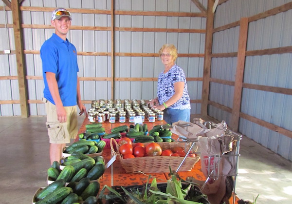 Workers help prepare produce at Neltner Farm in Camp Springs
