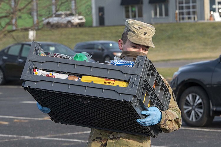 Kentucky National Guard members helped distribute food at Action Ministries in Latonia in December. 