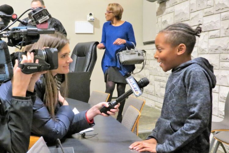 Dante Hall Jr. participated in the celebration at Erlanger City Hall and was  interviewed by local media.