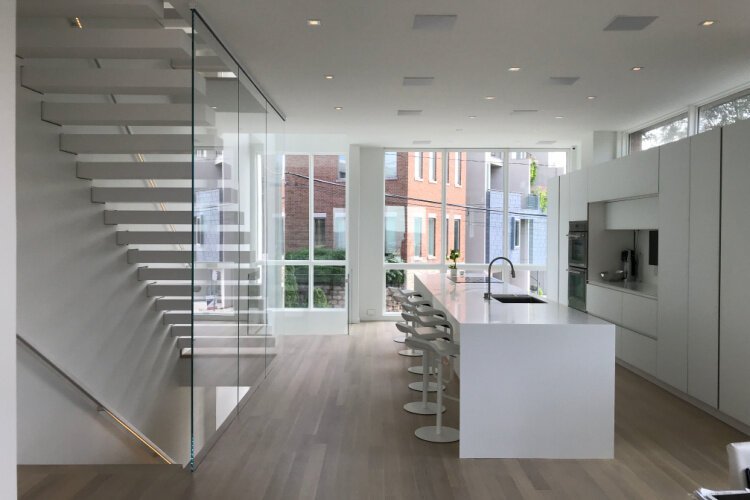 The sleek kitchen and staircase